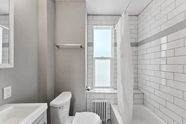 bathroom with toilet, a wealth of natural light, radiator heating unit, and shower / bath combo