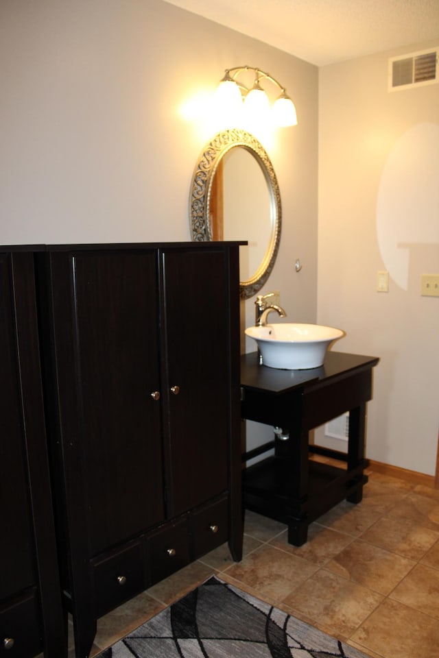 bathroom featuring a sink and visible vents