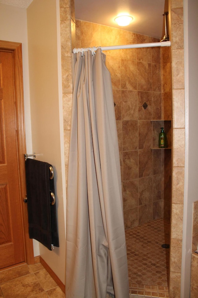 full bathroom featuring a shower stall
