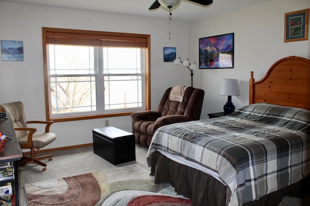 bedroom featuring carpet floors, a ceiling fan, and baseboards