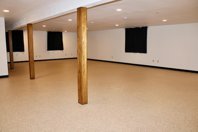 finished basement featuring recessed lighting and baseboards