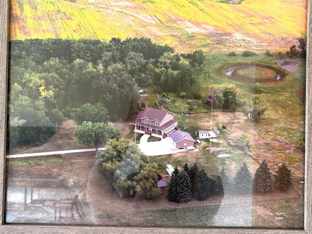 birds eye view of property with a rural view