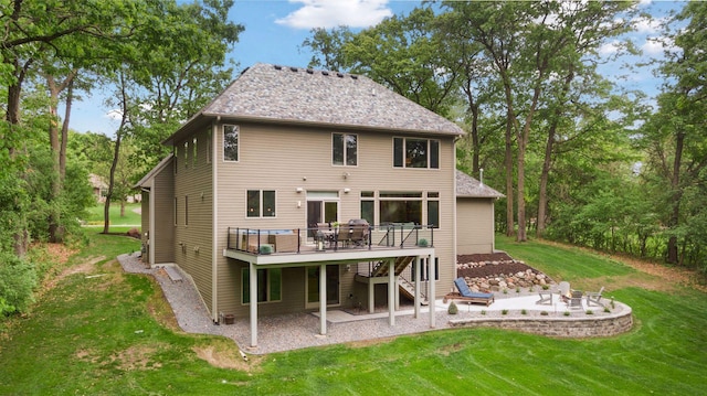 rear view of property featuring stairway, a patio area, a wooden deck, and a yard