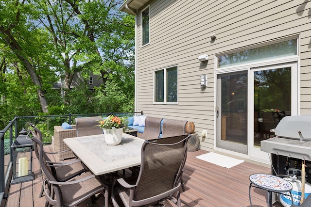 wooden deck with outdoor dining area