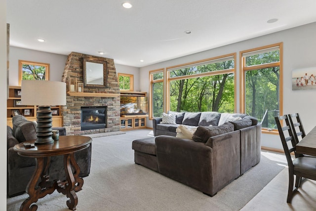 living area featuring recessed lighting and a large fireplace