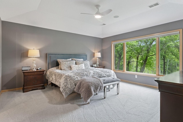 carpeted bedroom featuring baseboards, ceiling fan, and vaulted ceiling