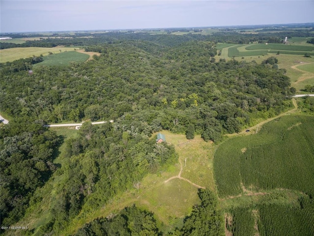 aerial view featuring a view of trees