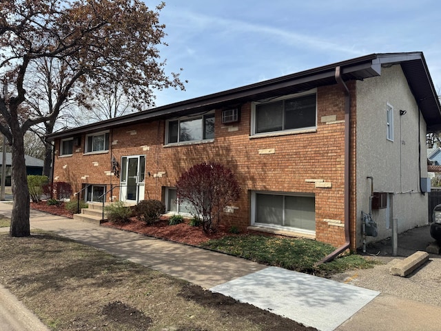 view of front facade featuring brick siding