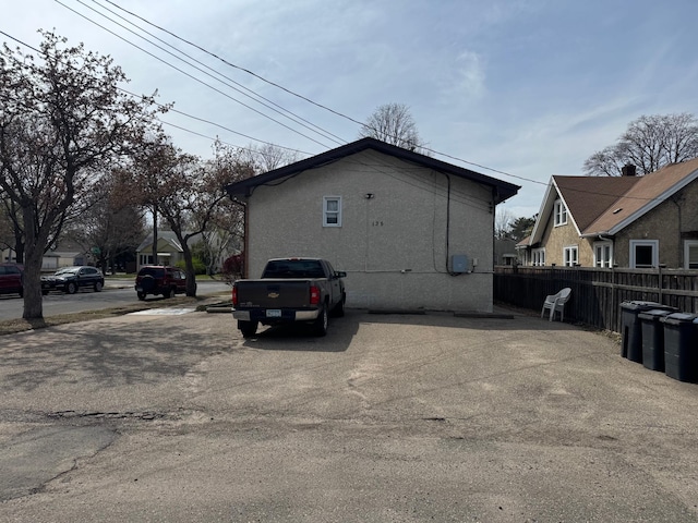 view of side of property with fence