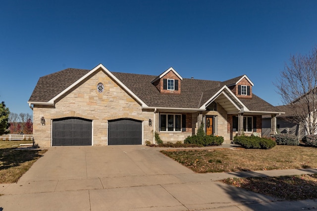view of front facade featuring a porch, roof with shingles, an attached garage, stone siding, and concrete driveway