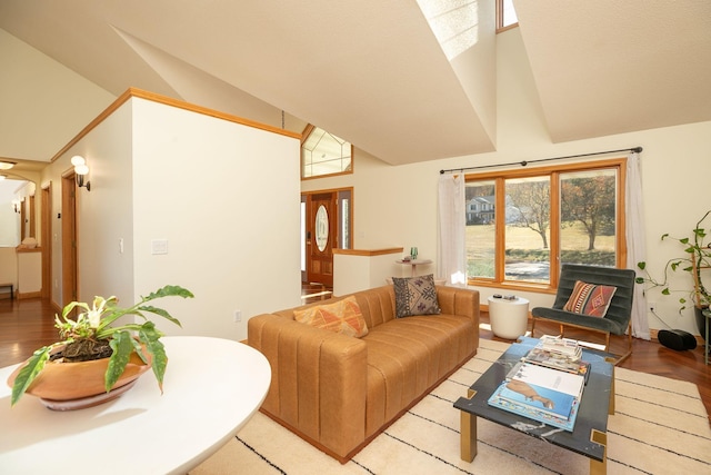 living room with high vaulted ceiling