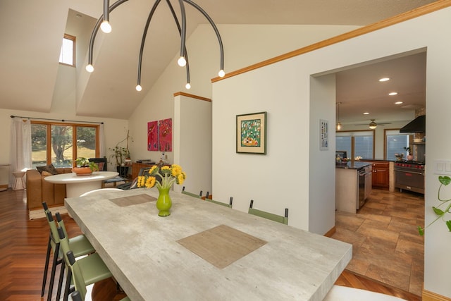dining room with ceiling fan, high vaulted ceiling, plenty of natural light, and recessed lighting