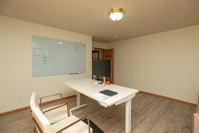office featuring wood finished floors and baseboards