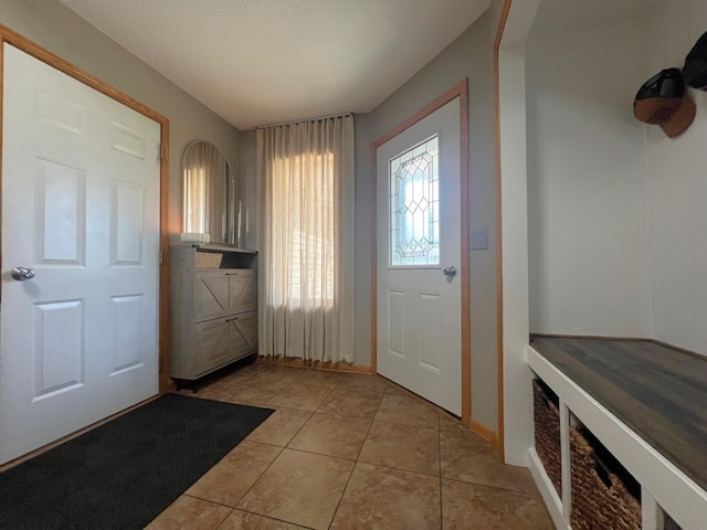 entrance foyer with light tile patterned floors