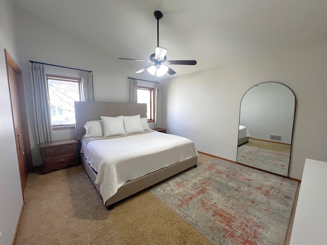 bedroom featuring vaulted ceiling, ceiling fan, and carpet floors