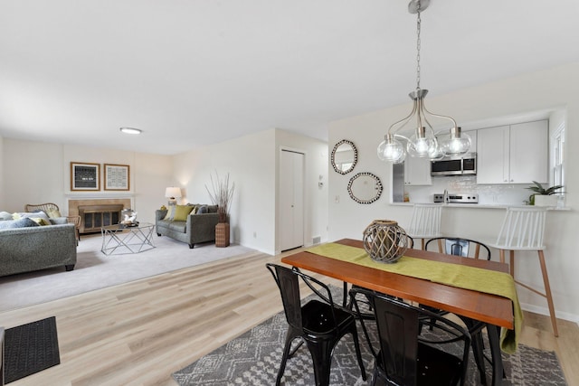304 Lakeview Ave, Long Lake, MN 55356 - dining room featuring light wood finished floors and baseboards
