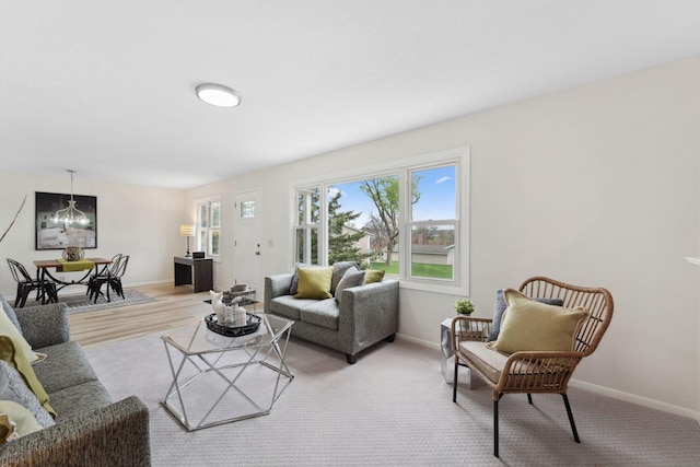 304 Lakeview Ave, Long Lake, MN 55356 - living room featuring baseboards and a notable chandelier