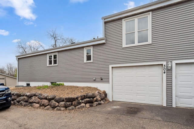 304 Lakeview Ave, Long Lake, MN 55356 - view of side of home featuring a garage