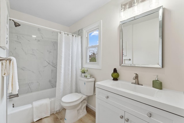 304 Lakeview Ave, Long Lake, MN 55356 - bathroom featuring toilet, wood finished floors, baseboards, shower / bathtub combination with curtain, and vanity