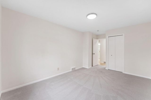 304 Lakeview Ave, Long Lake, MN 55356 - unfurnished bedroom featuring baseboards, a closet, visible vents, and light colored carpet