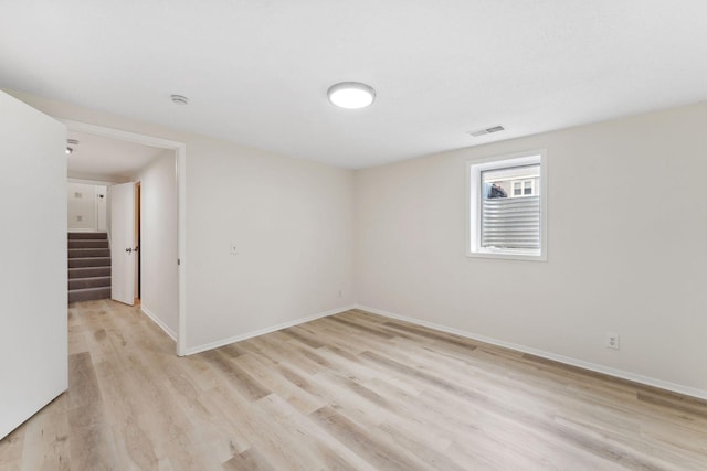 304 Lakeview Ave, Long Lake, MN 55356 - spare room featuring light wood-type flooring, stairs, baseboards, and visible vents