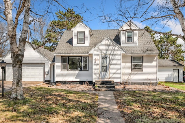 cape cod-style house featuring an attached garage, roof with shingles, driveway, and entry steps