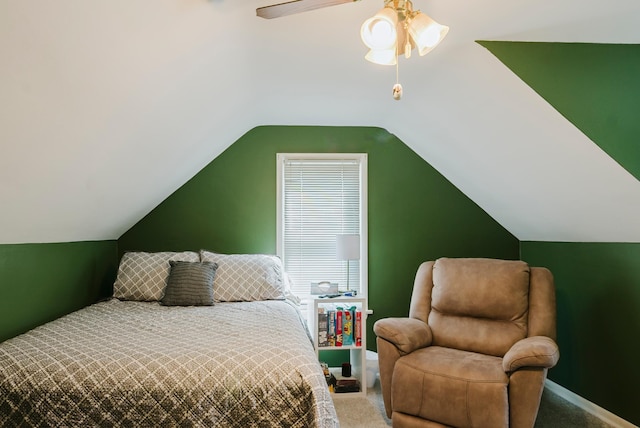 carpeted bedroom with a ceiling fan and vaulted ceiling