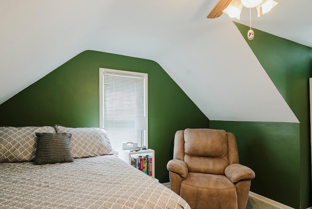 bedroom with carpet flooring, ceiling fan, vaulted ceiling, and multiple windows
