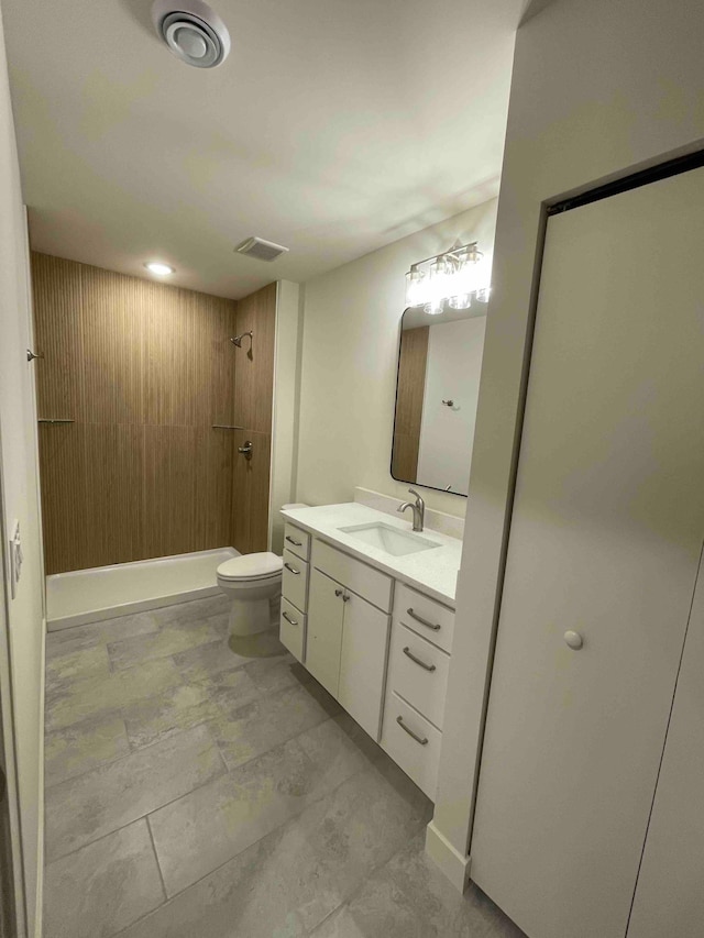 full bath with vanity, toilet, a shower, and visible vents