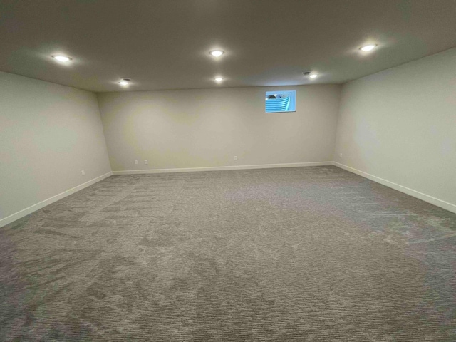 basement with carpet floors, recessed lighting, and baseboards