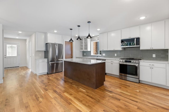 5345 45th Ave S, Minneapolis, MN 55417 - kitchen featuring stainless steel appliances, light countertops, light wood-type flooring, and recessed lighting