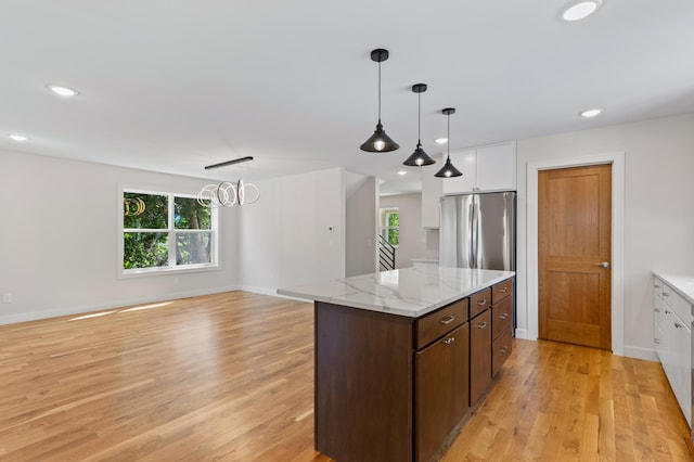 5345 45th Ave S, Minneapolis, MN 55417 - kitchen with light wood-type flooring, white cabinetry, a center island, decorative light fixtures, and recessed lighting