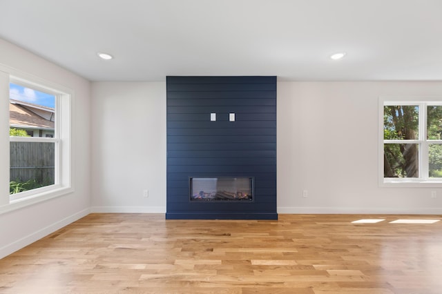 5345 45th Ave S, Minneapolis, MN 55417 - unfurnished living room featuring light wood finished floors, a fireplace, and recessed lighting