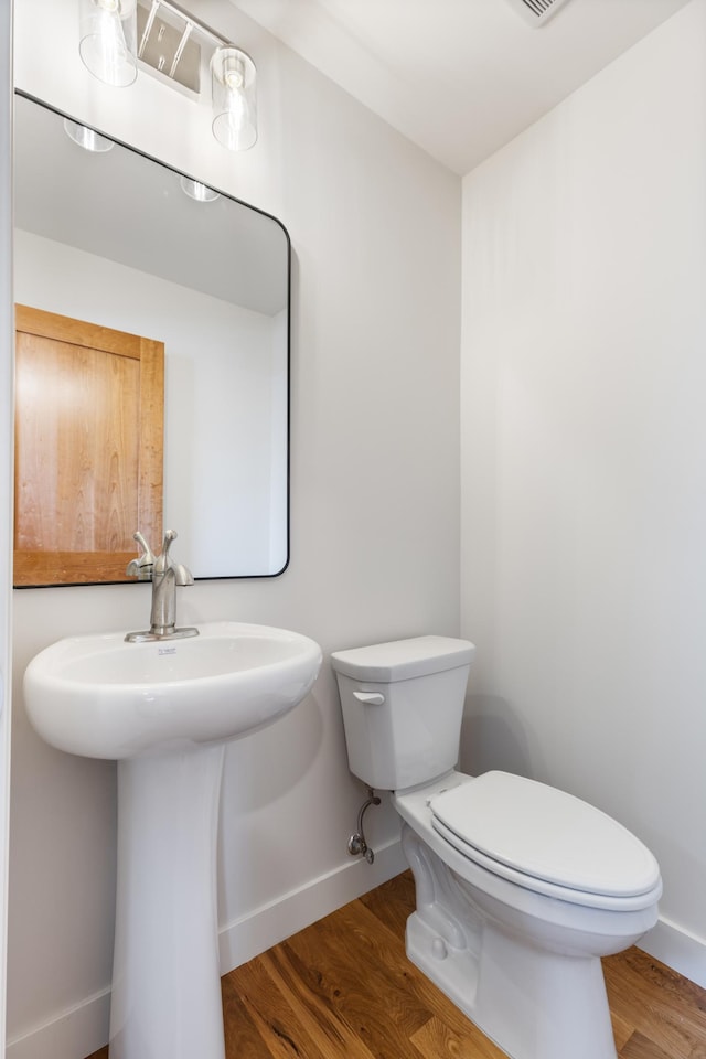 5345 45th Ave S, Minneapolis, MN 55417 - half bathroom featuring wood finished floors