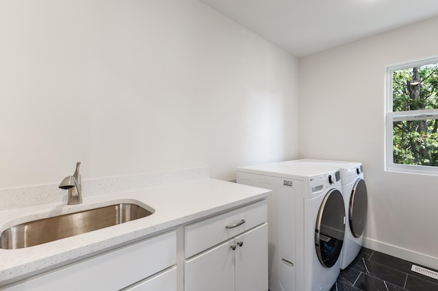 5345 45th Ave S, Minneapolis, MN 55417 - laundry area with independent washer and dryer and cabinet space