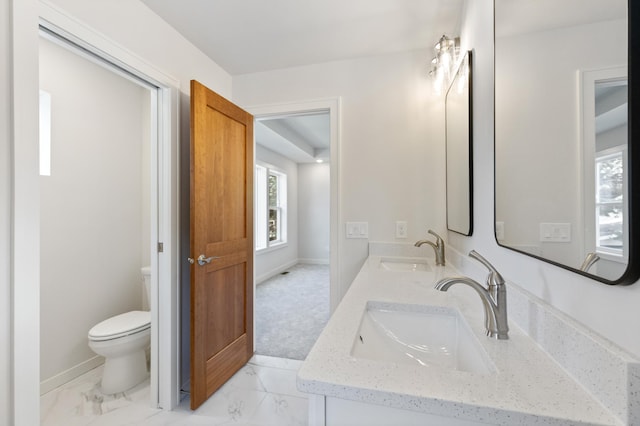 5345 45th Ave S, Minneapolis, MN 55417 - bathroom featuring double vanity, plenty of natural light, and marble finish flooring