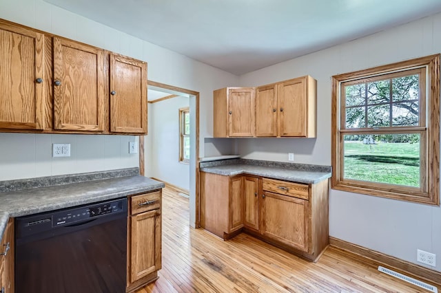 5159 Fawn Lake Dr NE, Linwood Twp, MN 55079 - kitchen with black dishwasher, dark countertops, light wood finished floors, and baseboards