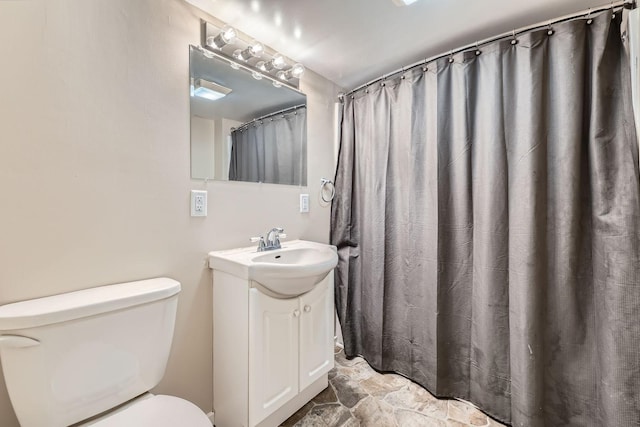 5159 Fawn Lake Dr NE, Linwood Twp, MN 55079 - bathroom featuring toilet, vanity, and stone finish flooring