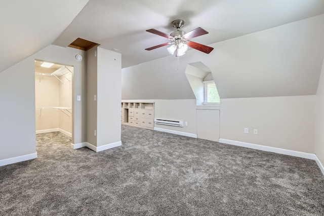5159 Fawn Lake Dr NE, Linwood Twp, MN 55079 - bonus room featuring a baseboard heating unit, ceiling fan, carpet, vaulted ceiling, and baseboards