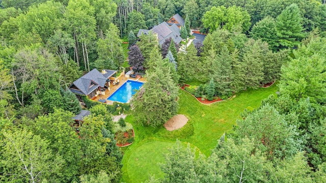 bird's eye view featuring a forest view