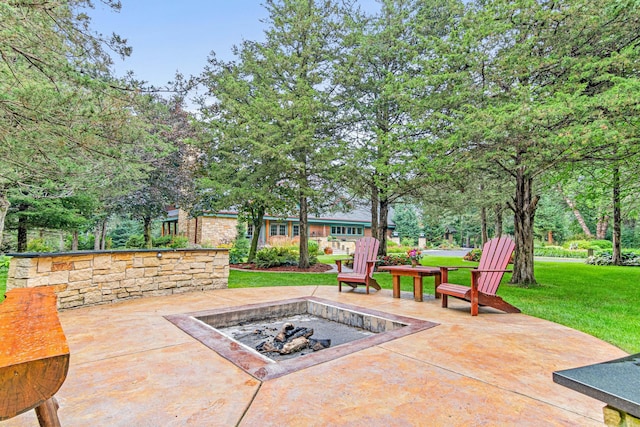 view of patio / terrace with an outdoor fire pit