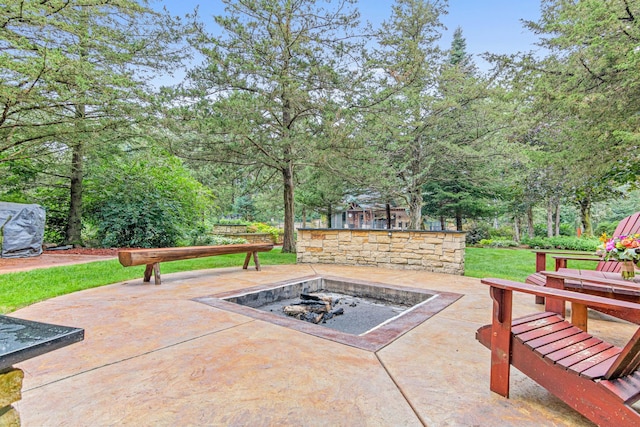 view of patio / terrace with a fire pit