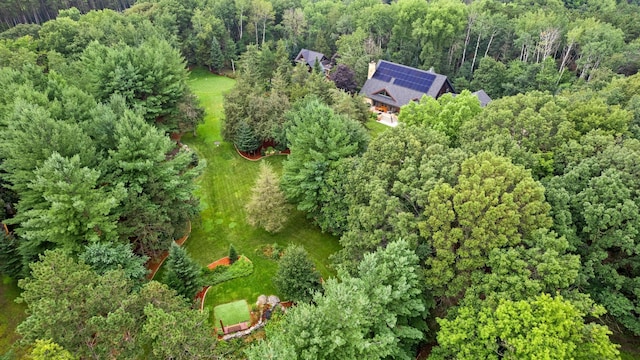 drone / aerial view featuring a view of trees