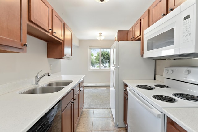 4387 Wilshire Blvd Unit 202, Mound, MN 55364 - kitchen with white appliances, a sink, brown cabinetry, and light countertops