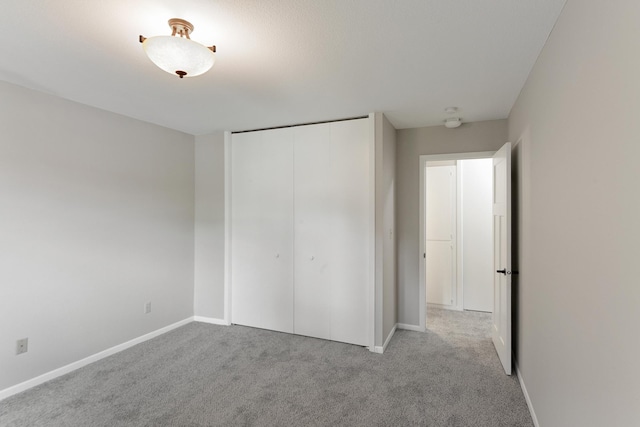 4387 Wilshire Blvd Unit 202, Mound, MN 55364 - unfurnished bedroom featuring carpet floors, a closet, and baseboards