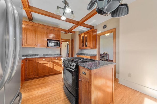 205 2nd St SW, Blooming Prairie, MN 55917 - kitchen with stainless steel refrigerator, black gas range, coffered ceiling, light wood-type flooring, and beam ceiling