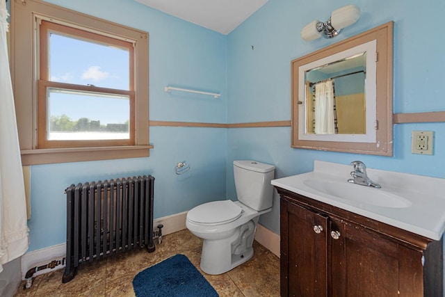 205 2nd St SW, Blooming Prairie, MN 55917 - bathroom featuring radiator, baseboards, vanity, toilet, and a shower with shower curtain