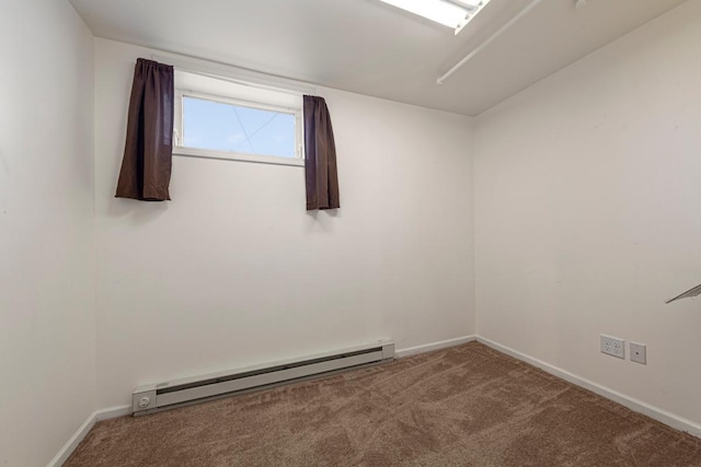 205 2nd St SW, Blooming Prairie, MN 55917 - carpeted empty room featuring a baseboard radiator and baseboards
