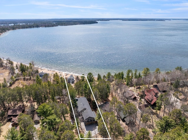aerial overview of property's location with a nearby body of water and property boundaries highlighted