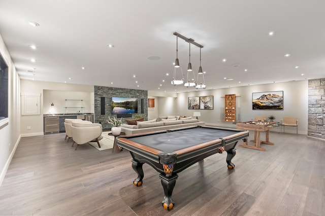 recreation room with light wood-style floors, recessed lighting, a stone fireplace, billiards table, and baseboards